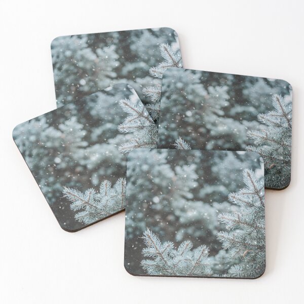 Item preview, Blue pine tree during snowfall designed and sold by EmelinaPhoto.