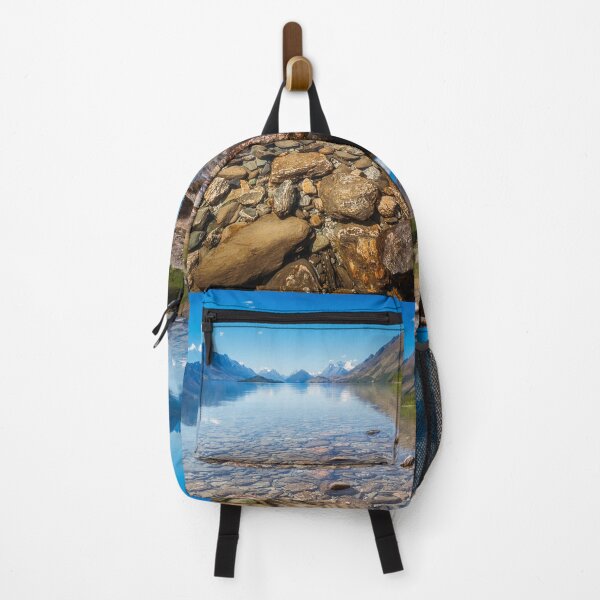 Item preview, Low angle view from the shore of Lake Wakatipu with snow capped mountains in the background designed and sold by Danielasphotos.