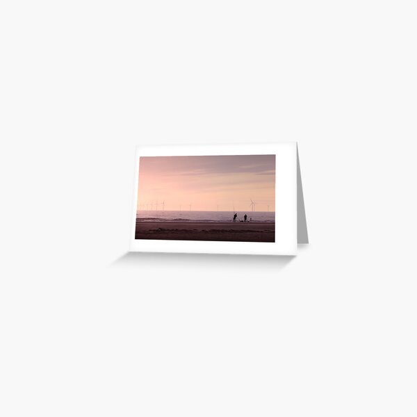 Pulling in the catch as the Sun Sets in Hoylake Greeting Card