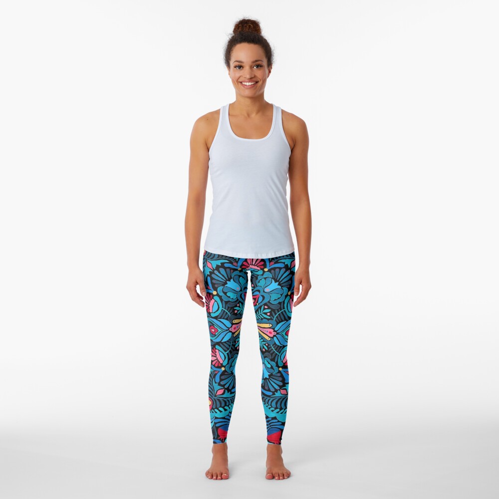 Pink, light blue springtime mandala on black Leggings