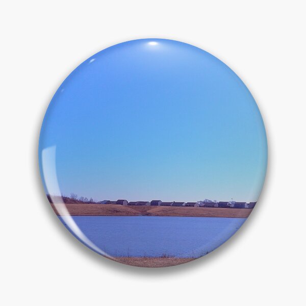Item preview, Pond under a blue sky in front of a distant grove of trees designed and sold by Mothe3rd.