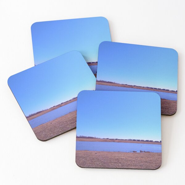 Item preview, Pond under a blue sky in front of a distant grove of trees designed and sold by Mothe3rd.