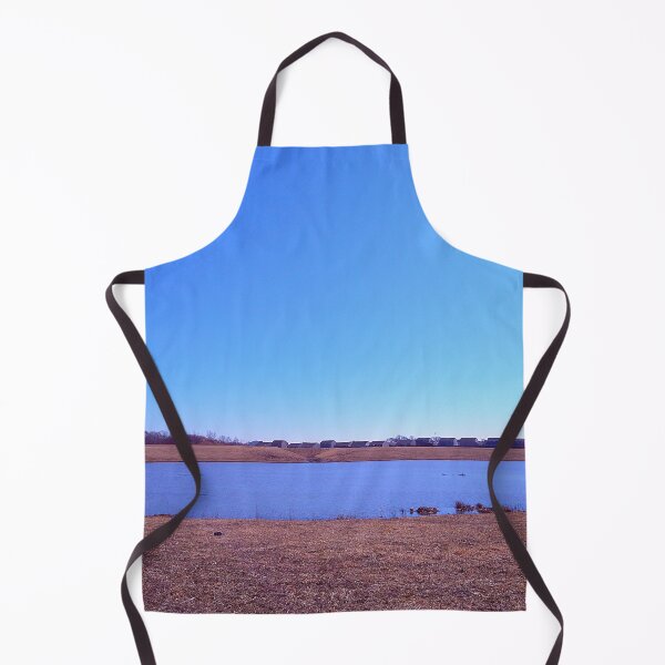 Item preview, Pond under a blue sky in front of a distant grove of trees designed and sold by Mothe3rd.