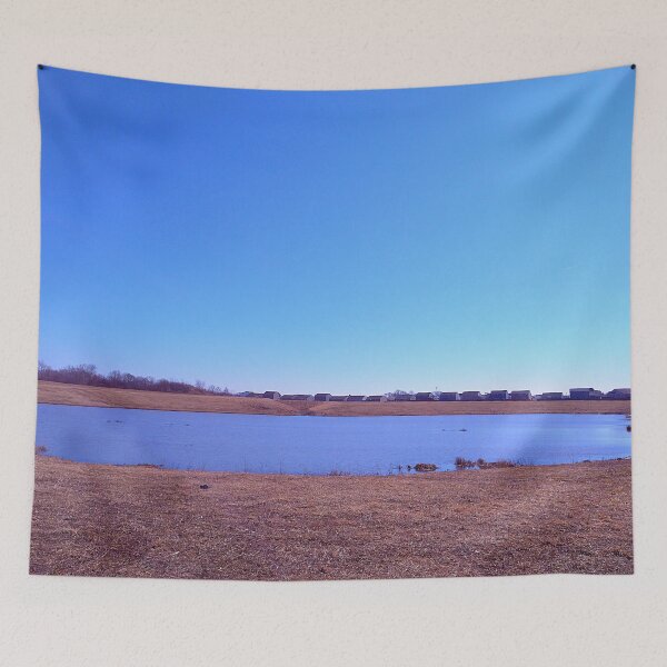 Item preview, Pond under a blue sky in front of a distant grove of trees designed and sold by Mothe3rd.