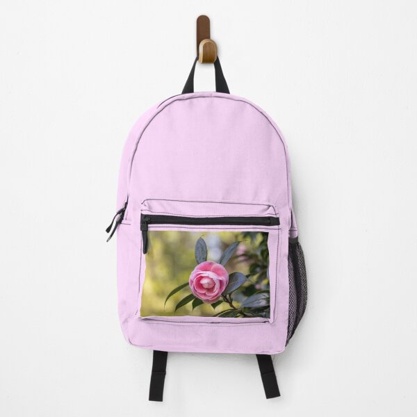 Item preview, Pink camellia flower, with branches and leaves in the background. designed and sold by AylaHarbich.