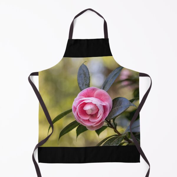 Item preview, Pink camellia flower, with branches and leaves in the background. designed and sold by AylaHarbich.