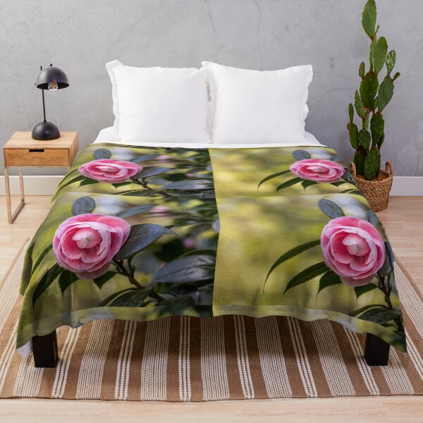 Item preview, Pink camellia flower, with branches and leaves in the background. designed and sold by AylaHarbich.