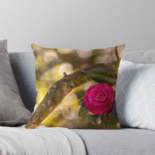 Item preview, Pink camellia flower, with branches and leaves in the background. designed and sold by AylaHarbich.