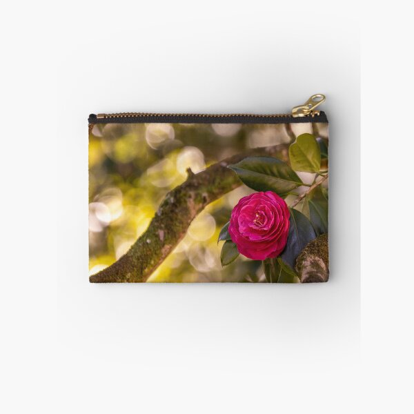 Item preview, Pink camellia flower, with branches and leaves in the background. designed and sold by AylaHarbich.