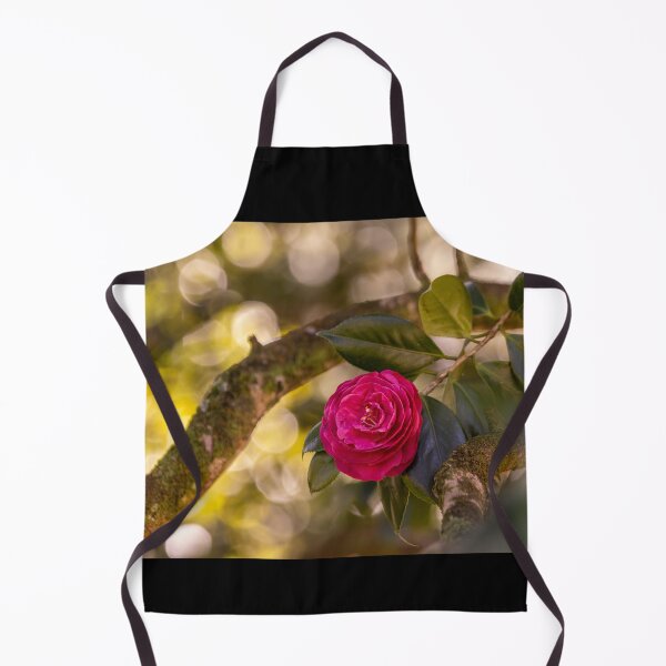 Item preview, Pink camellia flower, with branches and leaves in the background. designed and sold by AylaHarbich.