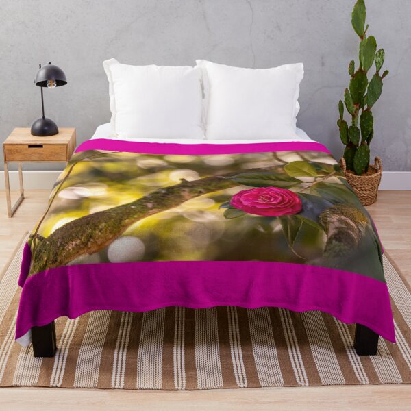Item preview, Pink camellia flower, with branches and leaves in the background. designed and sold by AylaHarbich.