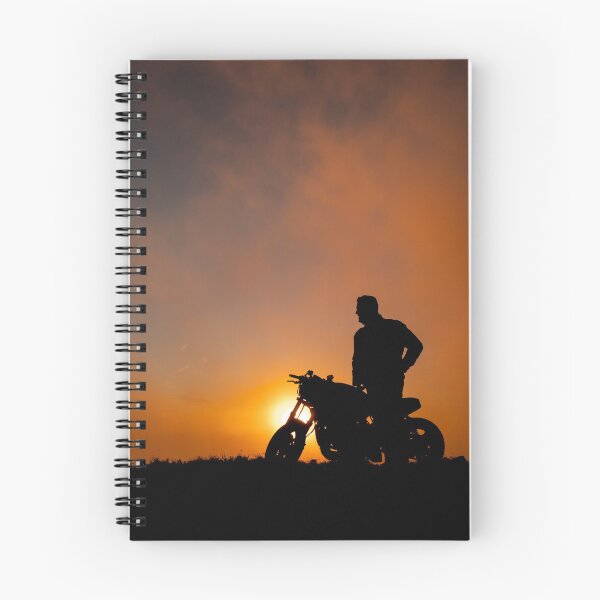 Item preview, Silhouette of motorbike and person in the sunset, with orange and yellow colors. designed and sold by AylaHarbich.