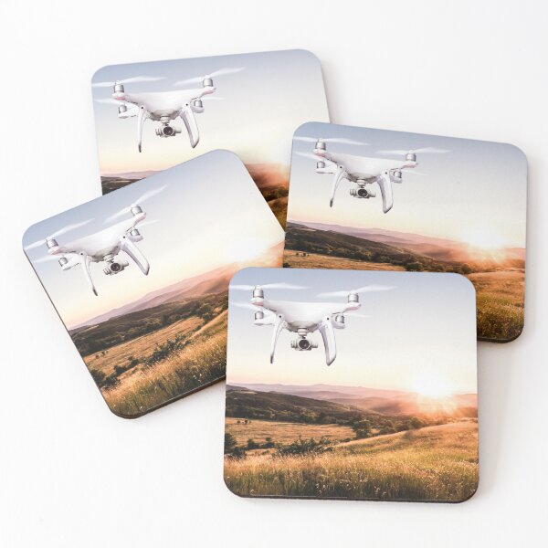 Item preview, Close up of hovering drone taking pictures of green meadows and hills at sunset designed and sold by TravelDrone.