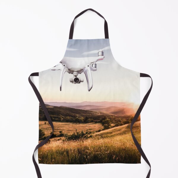 Item preview, Close up of hovering drone taking pictures of green meadows and hills at sunset designed and sold by TravelDrone.