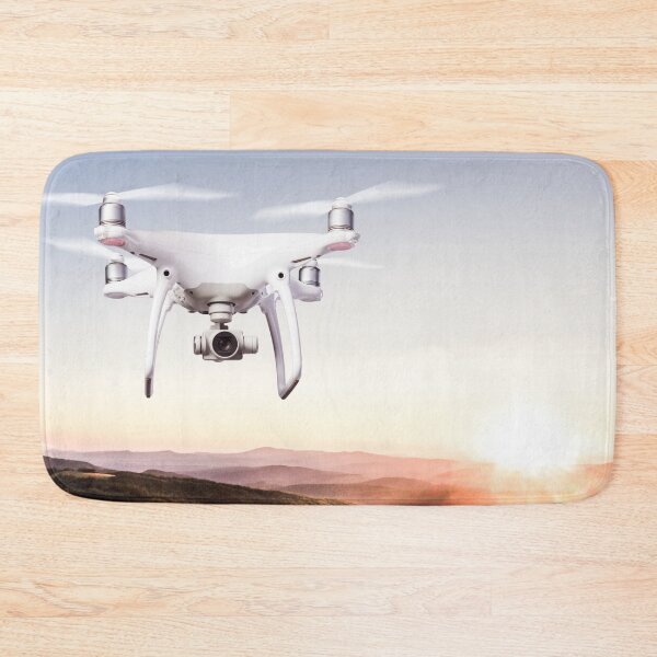 Item preview, Close up of hovering drone taking pictures of green meadows and hills at sunset designed and sold by TravelDrone.