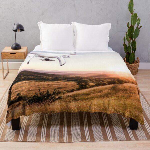 Item preview, Close up of hovering drone taking pictures of green meadows and hills at sunset designed and sold by TravelDrone.