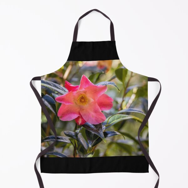 Item preview, Pink camellia flower, with branches and leaves in the background. designed and sold by AylaHarbich.