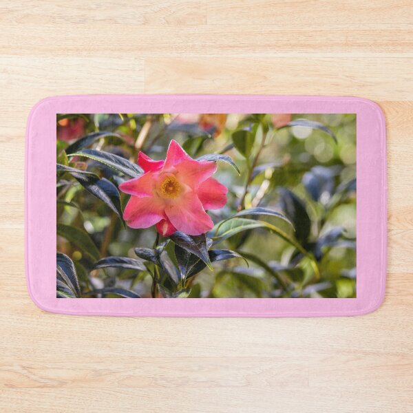 Item preview, Pink camellia flower, with branches and leaves in the background. designed and sold by AylaHarbich.