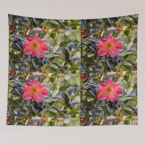 Item preview, Pink camellia flower, with branches and leaves in the background. designed and sold by AylaHarbich.