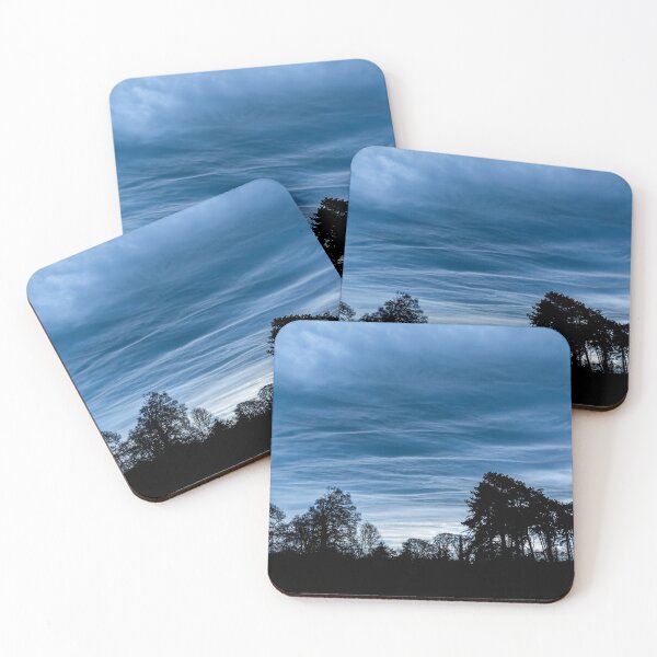 Item preview, A dramatic blue stormy sky with clouds at sunset over a forest in Ireland designed and sold by AlbertMi.