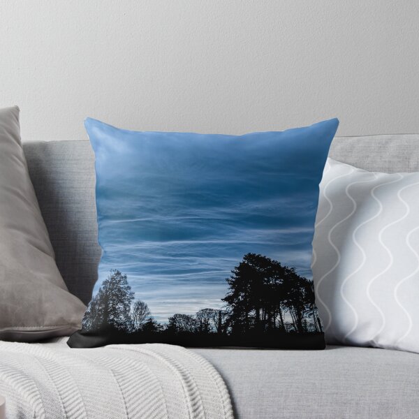 Item preview, A dramatic blue stormy sky with clouds at sunset over a forest in Ireland designed and sold by AlbertMi.