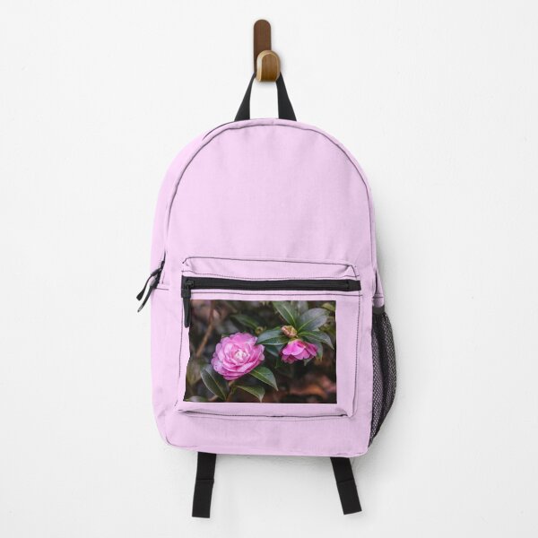 Item preview, Pink camellia flower, with branches and leaves in the background. designed and sold by AylaHarbich.