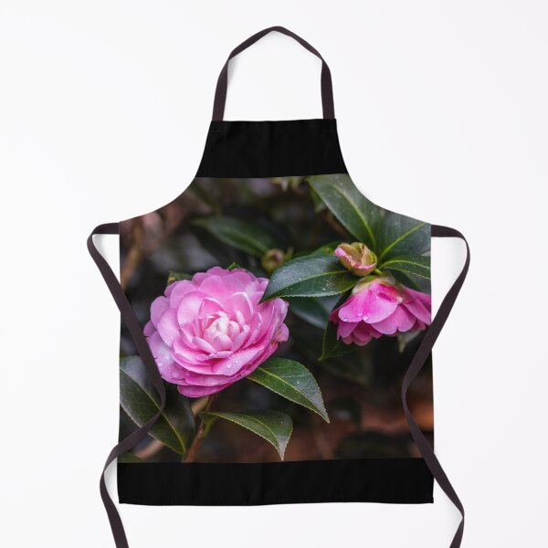 Item preview, Pink camellia flower, with branches and leaves in the background. designed and sold by AylaHarbich.
