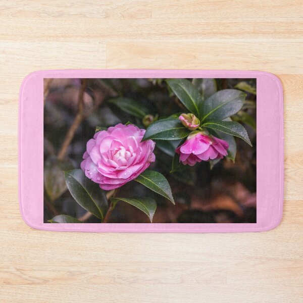 Item preview, Pink camellia flower, with branches and leaves in the background. designed and sold by AylaHarbich.