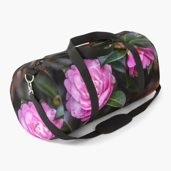 Item preview, Pink camellia flower, with branches and leaves in the background. designed and sold by AylaHarbich.