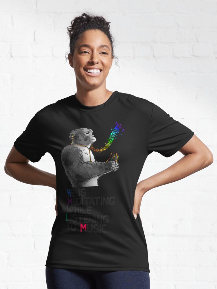 A monkey is meditating while listening to music. | Essential T-Shirt