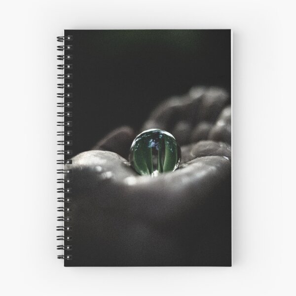 Item preview, Un hermoso mármol verde transparente sobre la mano en la oscuridad. designed and sold by FCEalin.