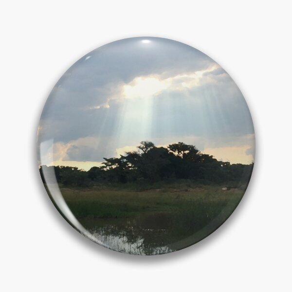 Item preview, Streaks of sunlight through clouds in an African sunset designed and sold by Miatopia.