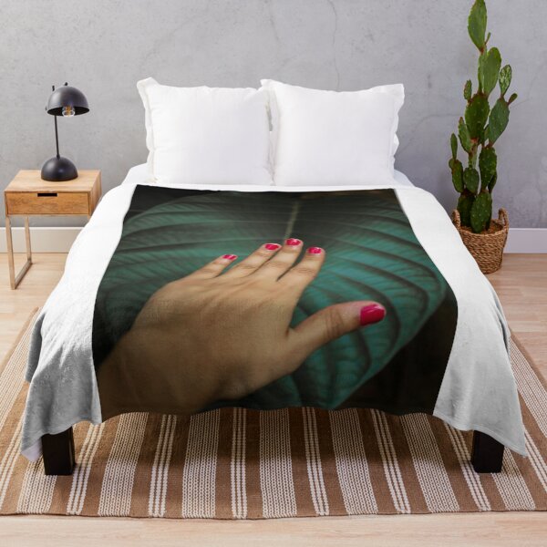 Item preview, A women's hand touching a big and beautiful leaf in nature designed and sold by FCEalin.