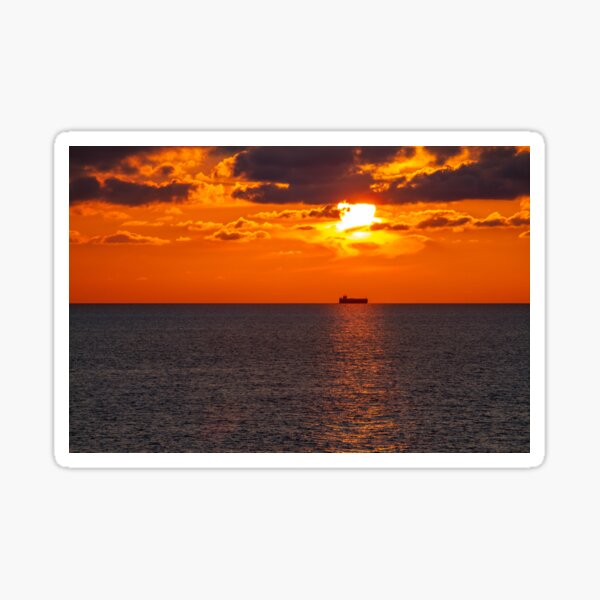 Cargo ship in the sunset Sticker