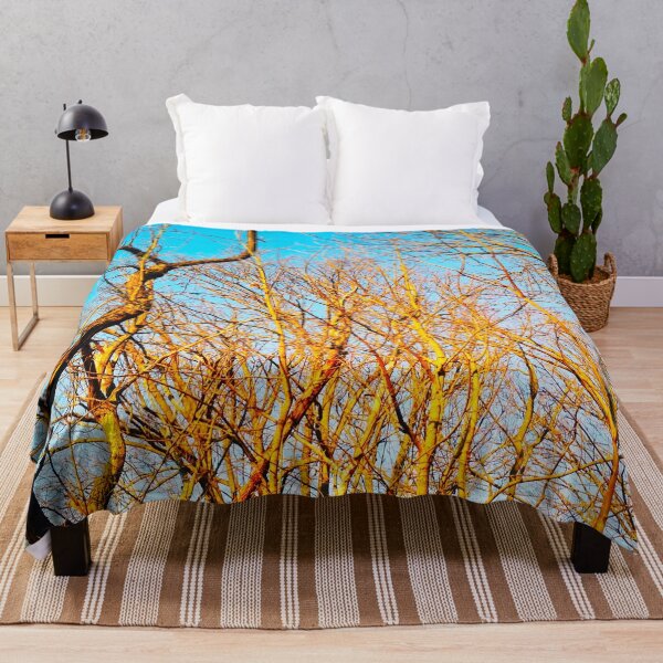 Item preview, Bare winter trees twisting and bending against the background of the blue cloudless sky designed and sold by helenkaiy.