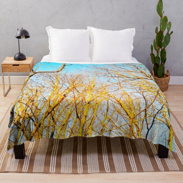 Item preview, Bare winter trees twisting and bending against the background of the blue cloudless sky designed and sold by helenkaiy.