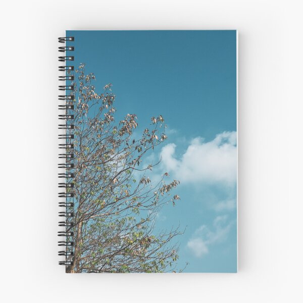 Item preview, A tree in front of the light blue cloudy sky designed and sold by FCEalin.