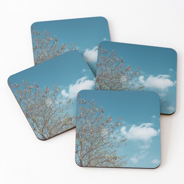 Item preview, A tree in front of the light blue cloudy sky designed and sold by FCEalin.