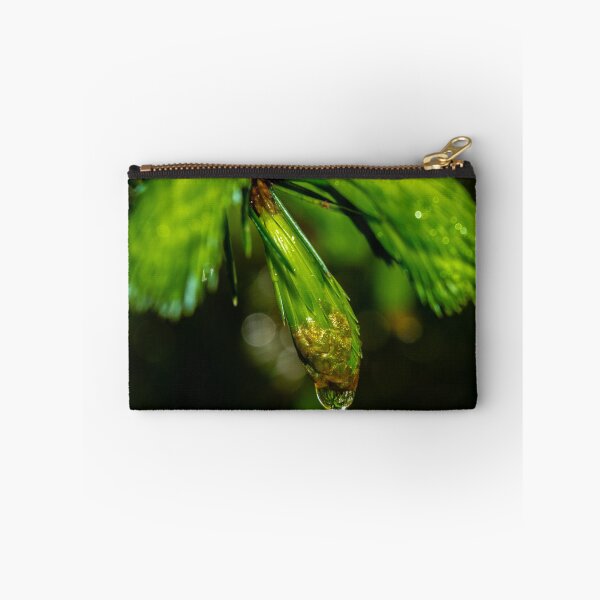 Item preview, Close up shot of reflective water drop on the pine branch in the Irish forest park morning time designed and sold by AlbertMi.