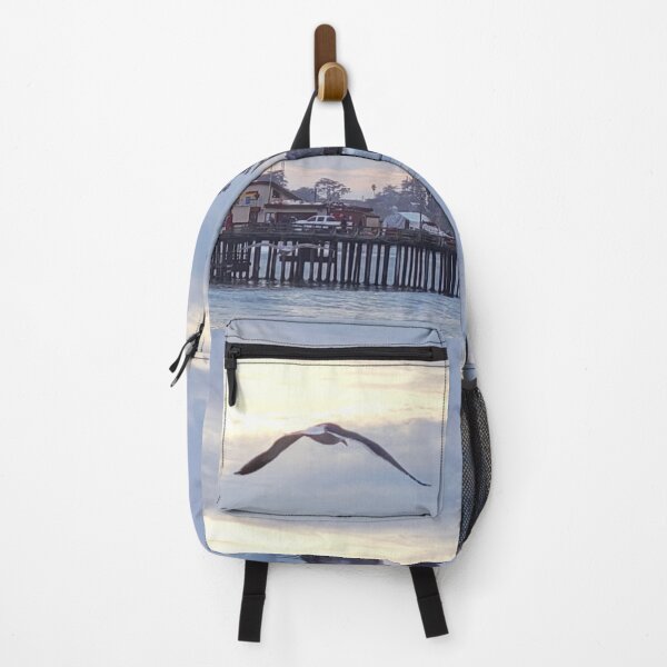 Item preview, Ocean pier with seagull at sunset designed and sold by teesonwheels.