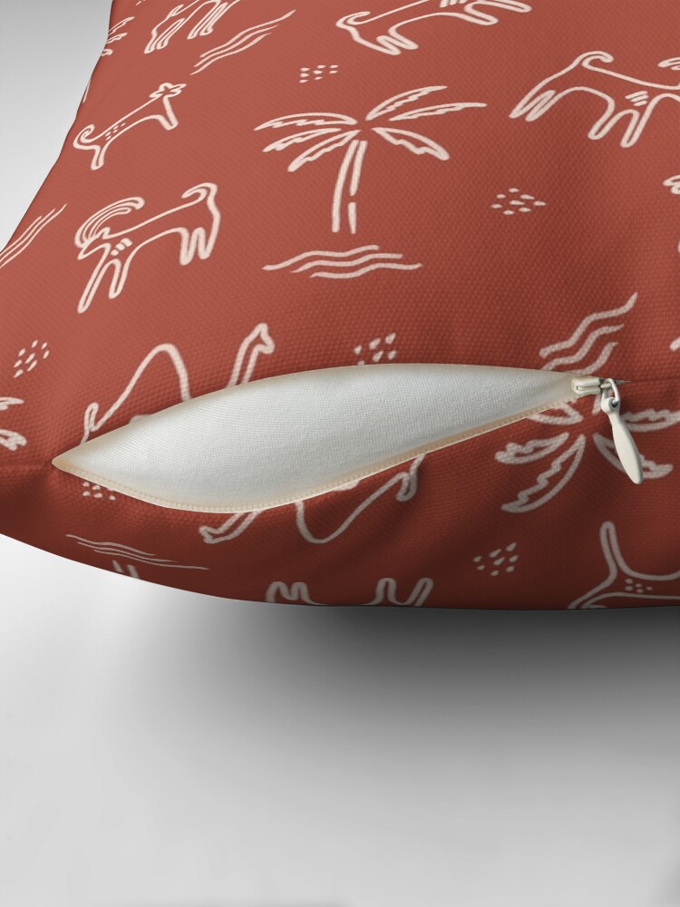 Thumbnail 2 of 4, Pillow, Rock Art Camels, and Arabian Wildlife in burnt umber designed and sold by CreatEVEdesign.