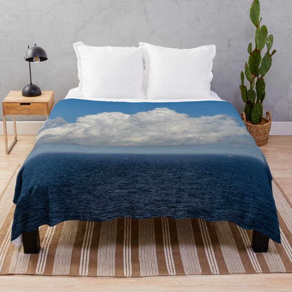 Item preview, White cumulus clouds in sky over blue Baltic sea designed and sold by lena-maximova.