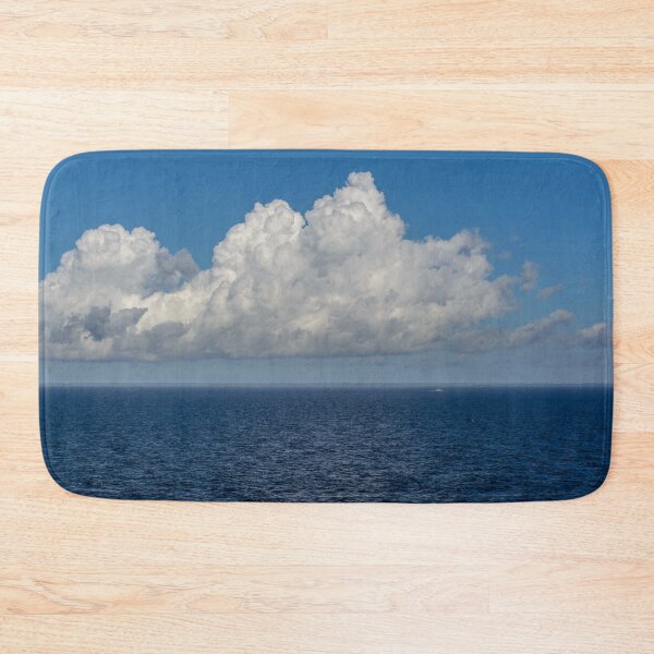 Item preview, White cumulus clouds in sky over blue Baltic sea designed and sold by lena-maximova.
