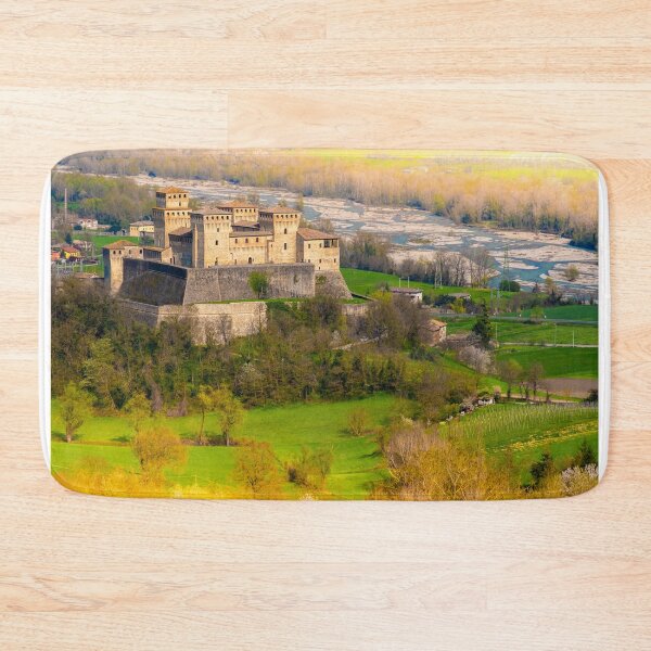 Item preview, aerial view of the medieval fairy castle with a colorful river and yellow lights at the edges beautiful background as in fairy tales designed and sold by fineartitalia.