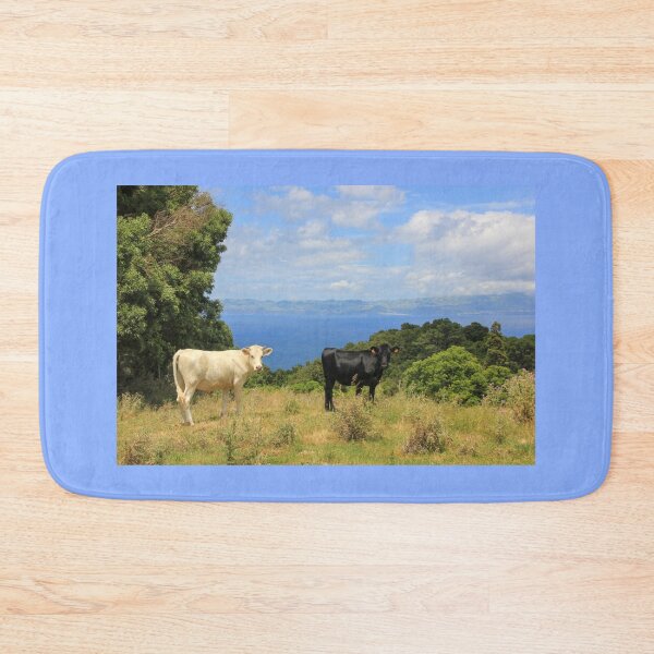 Item preview, Cute and funny looking cows with a great view over the Atlantic ocean, during hiking trail at the Azores island Pico, view to Sao Jorge island. designed and sold by AylaHarbich.