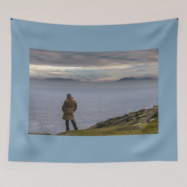 Item preview, Woman enjoying view of ocean with mountains and beautiful cloudscape, from Slieve League mountain on the Atlantic coast of County Donegal, Ireland designed and sold by AlbertMi.