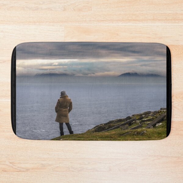 Item preview, Woman enjoying view of ocean with mountains and beautiful cloudscape, from Slieve League mountain on the Atlantic coast of County Donegal, Ireland designed and sold by AlbertMi.