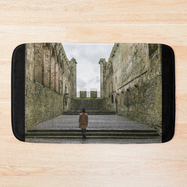 Item preview, A woman exploring the interior of The Rock of Cashel, also known as Cashel of the Kings and St. Patrick's Rock, is a historic site located at Cashel, County Tipperary, Ireland designed and sold by AlbertMi.