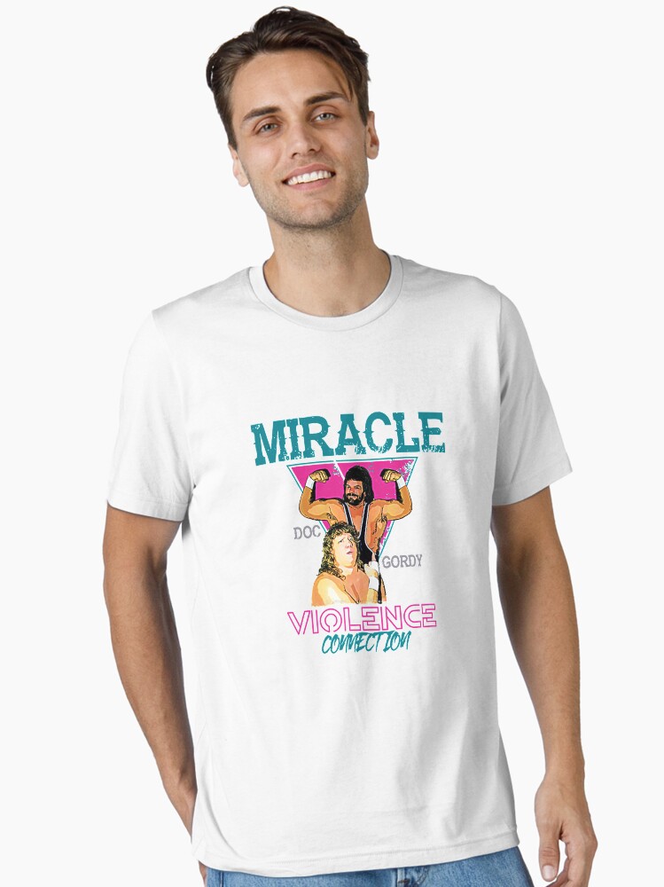 Thumbnail 1 of 7, Essential T-Shirt, Miracle Violence Connection - Dr. Death Steve Williams and Terry "Bam Bam" Gordy T-Shirt designed and sold by gluco2811.