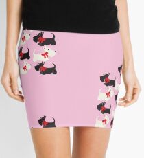 Red bow on pink_Copyright © BonniePortraits on Redbubble.com Mini Skirt